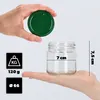 A hand holds a green lid above a glass jar, with measurement indicators and weight information displayed. Podgląd zdjęcia produktu