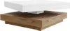 A modern coffee table with a white top and a wood-grain base, shown against a white background. Produktbild-Vorschau
