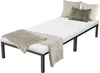 A white bed with a black metal frame, adorned with pillows and a blanket. Náhled obrázku produktu