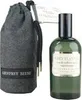 A bottle of Geoffrey Beene Grey Flannel Eau De Toilette spray and its accompanying fabric pouch are displayed against a white background. Náhľad obrázku produktu