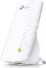 A white TP-Link Wi-Fi range extender is shown plugged into an outlet. Produktbild-Vorschau