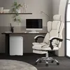 An office chair and desk setup in a room. Produktbild-Vorschau