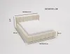 A 3D rendering of a cream-colored upholstered bed with dimensions indicated by lines and text. Náhľad obrázku produktu