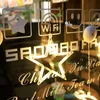 A close-up view of a window decorated with LED star lights and various icons. Produktbild-Vorschau