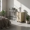 A bedroom scene with a desk, roll container, and bed. Náhled obrázku produktu