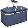 A blue picnic basket with silver handles on a white background. Voir les images du produit