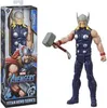 A Thor action figure is shown next to its packaging. The packaging features artwork of Thor and the Marvel Avengers logo. Náhľad obrázku produktu