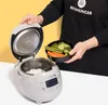 A person is adding cooked vegetables to a rice cooker with cooked rice. Anteprima dell’immagine prodotto