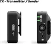 Two black wireless transmitters are shown against a white background. The left transmitter shows a USB-C port and a clip. The right transmitter shows indicator lights, a microphone input, and other controls. Anteprima dell’immagine prodotto