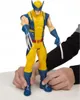 A toy Wolverine action figure is being held by two hands. Náhľad obrázku produktu