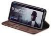 A smartphone in a brown flip case is displayed on a white background, showing a movie poster on its screen. Produktbild-Vorschau