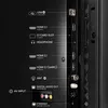 Close-up view of the back panel of a television, showing various input and output ports. Anteprima dell’immagine prodotto