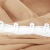 A close-up view of a beige curtain with a white header tape and plastic hooks. Anteprima dell’immagine prodotto