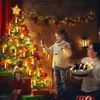 A mother and daughter decorating a Christmas tree with candle-shaped lights. Produktbild-Vorschau