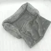 A gray plush pet bed is shown on a white surface. Náhľad obrázku produktu