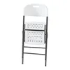 A folded white plastic folding chair with a gray metal frame against a white background. Podgląd zdjęcia produktu