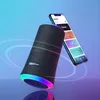 A Soundcore Flare II Bluetooth speaker is shown with a smartphone displaying an equalizer app, against a gradient blue and purple background with light trails. Produktbild-Vorschau