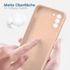 A hand is touching a pink phone case, highlighting its matte surface and soft grip. Produktbild-Vorschau