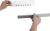 Hands are shown demonstrating how to use a retractable clothesline mounted on a wall. Podgląd zdjęcia produktu