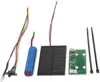 A collection of electronic components for a solar-powered light unit, including a battery, solar panel, circuit board, LED with switch, and cable ties, laid out on a white background. Anteprima dell’immagine prodotto