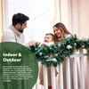 A family is decorating for Christmas with a garland. Anteprima dell’immagine prodotto