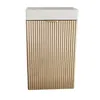 A front view of a white top bathroom cabinet with gold ribbed doors. Náhled obrázku produktu