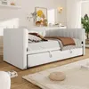A white daybed with a pull-out trundle bed is shown in a well-lit bedroom setting, styled with pillows and a throw blanket. Anteprima dell’immagine prodotto
