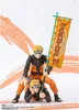 Two Naruto action figures are posed together, one sitting on the other's shoulders, holding a banner. Produktbild-Vorschau