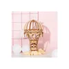 A wooden 3D puzzle of a hot air balloon is displayed on a white surface with a pink background and a white grid. Anteprima dell’immagine prodotto