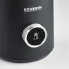 A close-up of a black appliance with a silver dial and a milk frothing icon. Produktbild-Vorschau