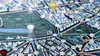 A close-up view of a board game, showing a map with pathways and game pieces. Produktbild-Vorschau