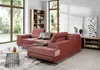 A living room scene with a large sectional sofa, coffee table, bookshelf, and TV stand. Produktbild-Vorschau