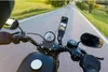 Riding a motorcycle on a road with a camera mounted on the handlebars. Produktbild-Vorschau