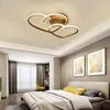 A bedroom with a bed, curtains, and artwork on the wall, featuring a heart-shaped ceiling lamp. Náhled obrázku produktu