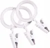 Three white curtain rings with clips attached, displayed against a white background. Podgląd zdjęcia produktu