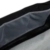 A close-up view of the interior mesh pockets of a bag. Produktbild-Vorschau