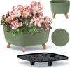 A square planter with pink and white flowers and a black insert shown in a collage with other views of the planter and a color swatch. Voir les images du produit