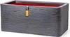 A rectangular planter with a textured dark gray exterior and a red interior, featuring a small orange tag with a logo and text. Náhľad obrázku produktu