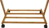A close-up view of the lower section of a bamboo mobile phone stand with wheels. Produktbild-Vorschau