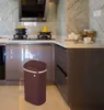 A kitchen setting with a trash can in the foreground. Voir les images du produit