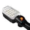 A close-up view of a black and clear LED work light with an orange button. Náhled obrázku produktu