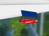 A close-up of a product attachment with a red and white patterned tape, attached to a white surface, with a blurred green and blue background. Produktbild-Vorschau