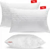 Three white quilted pillows are arranged in a stacked formation against a white background. Produktbild-Vorschau