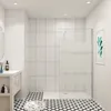 A modern bathroom with a walk-in shower, vanity, and patterned floor. Produktbild-Vorschau