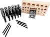 A set of metal punches and a wooden block with circular indentations, arranged on a white background. Produktbild-Vorschau