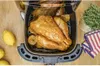 A roasted turkey in an air fryer with lemons and herbs. Voir les images du produit