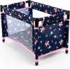 A doll's travel crib with a floral pattern. Produktbild-Vorschau