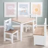 A children's table and chair set with artwork on the wall. Produktbild-Vorschau
