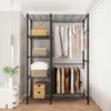 A wire shelving unit with clothes hanging on it, set up as a closet. Voir les images du produit