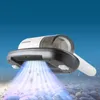 A handheld vacuum cleaner is shown hovering over a surface with blue light emanating from its underside, suggesting suction or cleaning action. Voir les images du produit